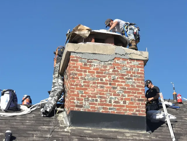 Dana Point Chimney Sweep installing a custom chimney crown in Dana Point, CA