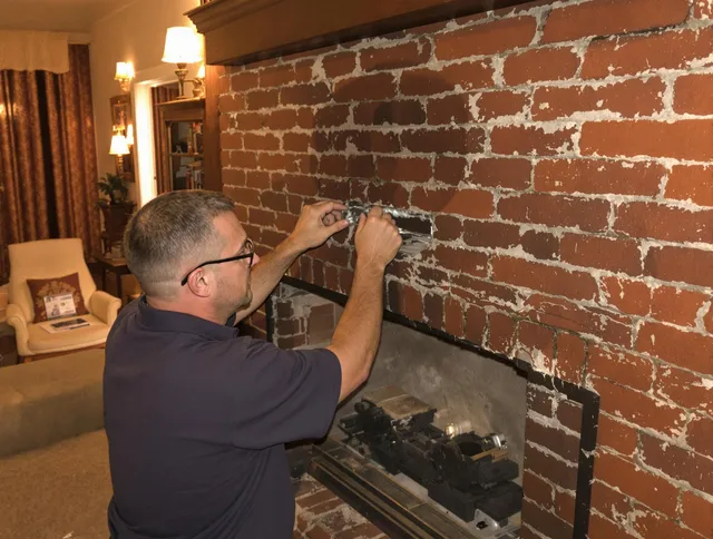 Dana Point Chimney Sweep expert fixing a fireplace in Dana Point, CA